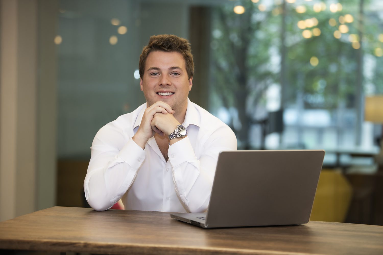 Jack DeBrabander, entrepreneur and founder of Strategy B CRM, at his desk with a laptop